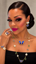 Model wearing the Jardin d’Azur butterfly and flower jewelry set
